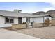 Well-kept single-story home featuring a secure gated yard and desert landscaping, offering curb appeal and security at 1730 W Pershing Ave, Phoenix, AZ 85029