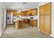 Spacious kitchen featuring oak cabinets, a large island, and modern stainless steel appliances, perfect for cooking at 1730 W Pershing Ave, Phoenix, AZ 85029