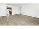 Spacious living room featuring modern wood-look tile flooring, creating a stylish and low-maintenance living space at 1730 W Pershing Ave, Phoenix, AZ 85029