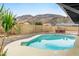 An in-ground pool is fenced and features desert landscaping at 1730 W Pershing Ave, Phoenix, AZ 85029