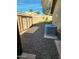 Private backyard area features a shed, stone landscaping, an AC unit and patch of artificial grass at 1920 E Manzanita Dr, Phoenix, AZ 85020