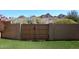 This backyard gate is set within a privacy wall, leading to the rest of the yard at 1920 E Manzanita Dr, Phoenix, AZ 85020