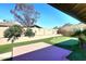 This backyard features a putting green, brick patio, privacy wall, and view of the mountains at 1920 E Manzanita Dr, Phoenix, AZ 85020