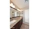 Bathroom with double sink, granite countertop, and large mirror with vanity lighting, offering a functional space at 1920 E Manzanita Dr, Phoenix, AZ 85020