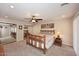 Spacious bedroom featuring a ceiling fan, natural light, and carpet, offering a comfortable retreat at 1920 E Manzanita Dr, Phoenix, AZ 85020