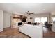 Bright living room with hardwood floors, fireplace, built-in shelving, and sliding glass doors for natural light at 1920 E Manzanita Dr, Phoenix, AZ 85020