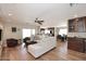 Open living room with hardwood floors, recessed lighting, and comfortable seating connected to the kitchen and dining area at 1920 E Manzanita Dr, Phoenix, AZ 85020