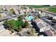 Aerial view of a residential area with a community pool and park surrounded by well-maintained homes and green spaces at 1998 S Starling Dr, Gilbert, AZ 85295