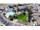 Aerial view of a neighborhood featuring a community pool and park, offering recreational amenities and a sense of community at 1998 S Starling Dr, Gilbert, AZ 85295