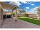 Back patio of this home features a covered area and lush green grass at 1998 S Starling Dr, Gilbert, AZ 85295