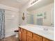 Bright bathroom featuring a single sink vanity, bathtub with shower, and coastal-themed decor for a relaxing space at 1998 S Starling Dr, Gilbert, AZ 85295