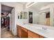 Bathroom featuring a large double vanity with two sinks and bright lighting fixtures at 1998 S Starling Dr, Gilbert, AZ 85295