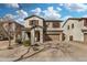 Two-story home featuring a two-car garage, shutters, and landscaped front yard at 1998 S Starling Dr, Gilbert, AZ 85295