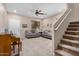 Comfortable living room with a neutral color scheme, plush sofas, and a staircase at 1998 S Starling Dr, Gilbert, AZ 85295