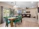 The dining area flows into the living room featuring access to the backyard and providing ample natural light at 1998 S Starling Dr, Gilbert, AZ 85295