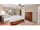 Bright main bedroom showcasing a large wooden dresser, plush carpet and two large windows at 1998 S Starling Dr, Gilbert, AZ 85295