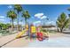 Colorful playground with slides and climbing frames, surrounded by benches and lush green trees at 1998 S Starling Dr, Gilbert, AZ 85295