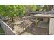 Aerial view of a large backyard featuring mature trees, a patio, and privacy fencing at 2007 S El Camino Dr, Tempe, AZ 85282