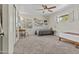 Bright bedroom with neutral carpet, fan and natural light from two windows at 2007 S El Camino Dr, Tempe, AZ 85282