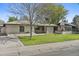 Charming single-story home featuring a well-manicured lawn and a stucco facade, capturing timeless curb appeal at 2007 S El Camino Dr, Tempe, AZ 85282