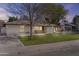 Charming single-story home featuring a well-manicured lawn and a stucco facade, capturing timeless curb appeal at 2007 S El Camino Dr, Tempe, AZ 85282