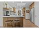 Modern kitchen with an island, stainless steel appliances, a skylight, and charming breakfast bar seating at 2007 S El Camino Dr, Tempe, AZ 85282