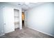 Bedroom leading to a bathroom, with closet and fan at 20471 E Carriage Way, Queen Creek, AZ 85142