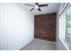 Modern bedroom with geometric wood accent wall, neutral carpet, and window at 20471 E Carriage Way, Queen Creek, AZ 85142