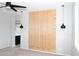 Bedroom featuring a wood slat accent wall and stylish pendant lighting at 20471 E Carriage Way, Queen Creek, AZ 85142