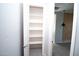 Walk-in closet featuring white shelving and modern floors at 20471 E Carriage Way, Queen Creek, AZ 85142