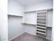 Walk-in closet featuring custom shelving for organized storage at 20471 E Carriage Way, Queen Creek, AZ 85142