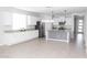 Expansive kitchen featuring granite countertops, stainless steel appliances and a decorative island at 20471 E Carriage Way, Queen Creek, AZ 85142