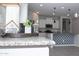 Granite kitchen countertop adorned with tasteful decor, offering a view of the stylish island at 20471 E Carriage Way, Queen Creek, AZ 85142