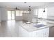 Open concept kitchen featuring granite countertops and modern fixtures at 20471 E Carriage Way, Queen Creek, AZ 85142