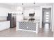 Spacious kitchen boasts a central island with patterned accents and stainless steel appliances at 20471 E Carriage Way, Queen Creek, AZ 85142