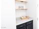 Laundry room with shelving, cabinets, and countertop space for functionality and style at 20471 E Carriage Way, Queen Creek, AZ 85142