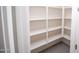 Walk-in pantry featuring white shelving and tile floors at 20471 E Carriage Way, Queen Creek, AZ 85142