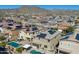 A scenic aerial view of homes with pools and solar panels at 21195 W Coronado Rd, Buckeye, AZ 85396