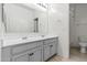 A bathroom featuring a large mirror and a double sink vanity with drawers at 21195 W Coronado Rd, Buckeye, AZ 85396