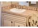 Bathroom vanity with decorative tile trim, faucet, and chair at 22020 N San Ramon Dr, Sun City West, AZ 85375