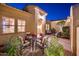 Beautiful courtyard featuring an arched front entrance and inviting outdoor seating at 22020 N San Ramon Dr, Sun City West, AZ 85375