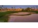 Scenic view of the golf course from the property highlighting the well-manicured green and sand trap at 22020 N San Ramon Dr, Sun City West, AZ 85375