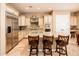 Modern kitchen featuring a large island with seating and stainless steel appliances at 22020 N San Ramon Dr, Sun City West, AZ 85375