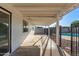 Covered back patio overlooking the pebble landscaping with pool views at 2336 W Plata Ave, Mesa, AZ 85202