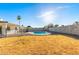 Expansive backyard with lush greenery, perfect for outdoor activities and entertaining with fenced pool area at 2336 W Plata Ave, Mesa, AZ 85202