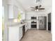 Modern kitchen with white cabinets, stainless steel appliances, and stylish tile flooring at 2336 W Plata Ave, Mesa, AZ 85202