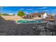 Sparkling backyard pool surrounded by gravel landscaping, creating a serene outdoor oasis at 2336 W Plata Ave, Mesa, AZ 85202