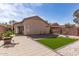 Backyard featuring a patio, artificial grass, and block wall fencing at 23430 W Pima St, Buckeye, AZ 85326