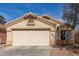 Charming single-story home featuring a two-car garage, neutral stucco, and tile roof at 23430 W Pima St, Buckeye, AZ 85326