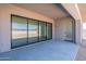 The covered patio with a sliding glass door provides a seamless transition to the outdoors at 24066 S 218Th Pl, Queen Creek, AZ 85142